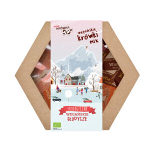 super krówka prezentowy box świąteczny mix krówek wegańskich; szećiokątne pudełko z pzrezrocystym wiekiem, w środku widać trzy smaki krówek, na wierzchu label ze świąteczną grafiką